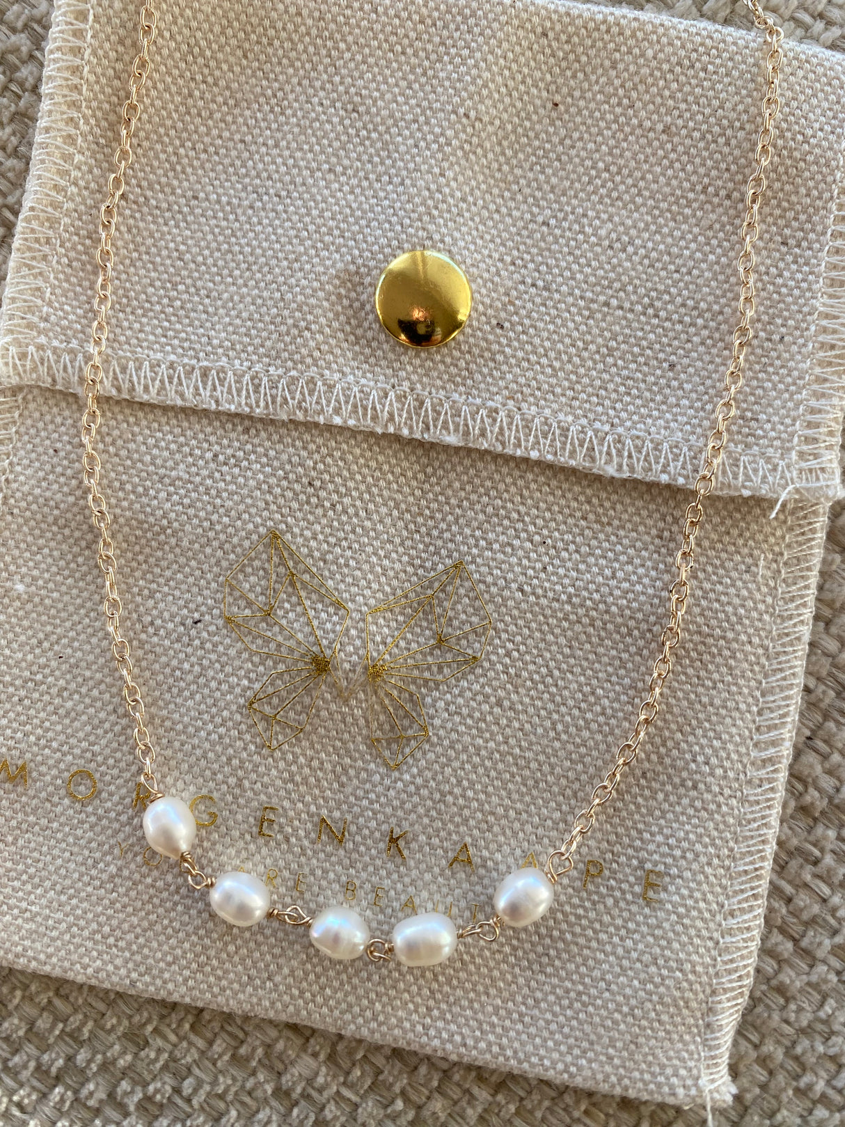 Smykke med små ferskvannsperler